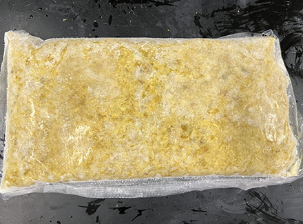 A container of shredded orange peels.